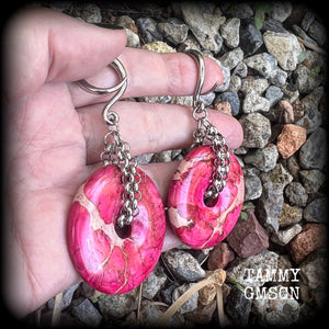 This pair of gorgeous ocean jasper earrings features beautiful pink marbled donut gemstones, weighing approx 19 grams a piece, and measuring 8cms from tip to tip.

This pair has been made on 6 gauge (4mm) surgical steel full curl hooks, to be worn in stretched lobes.