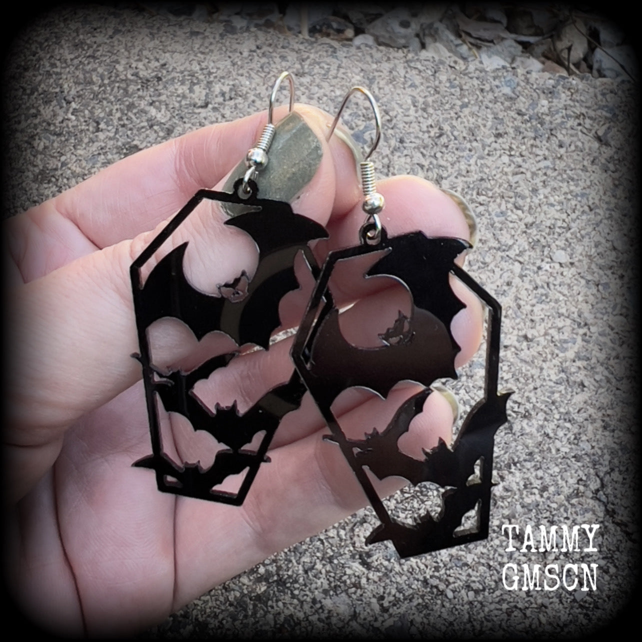 These awesome earrings feature pitch black acrylic coffins filled with bats! These earrings measure just over 6 cms from tip to tip and are nice and lightweight at only a few grams each.

This pair have been made on stainless steel french hooks, to be worn in pierced ears.