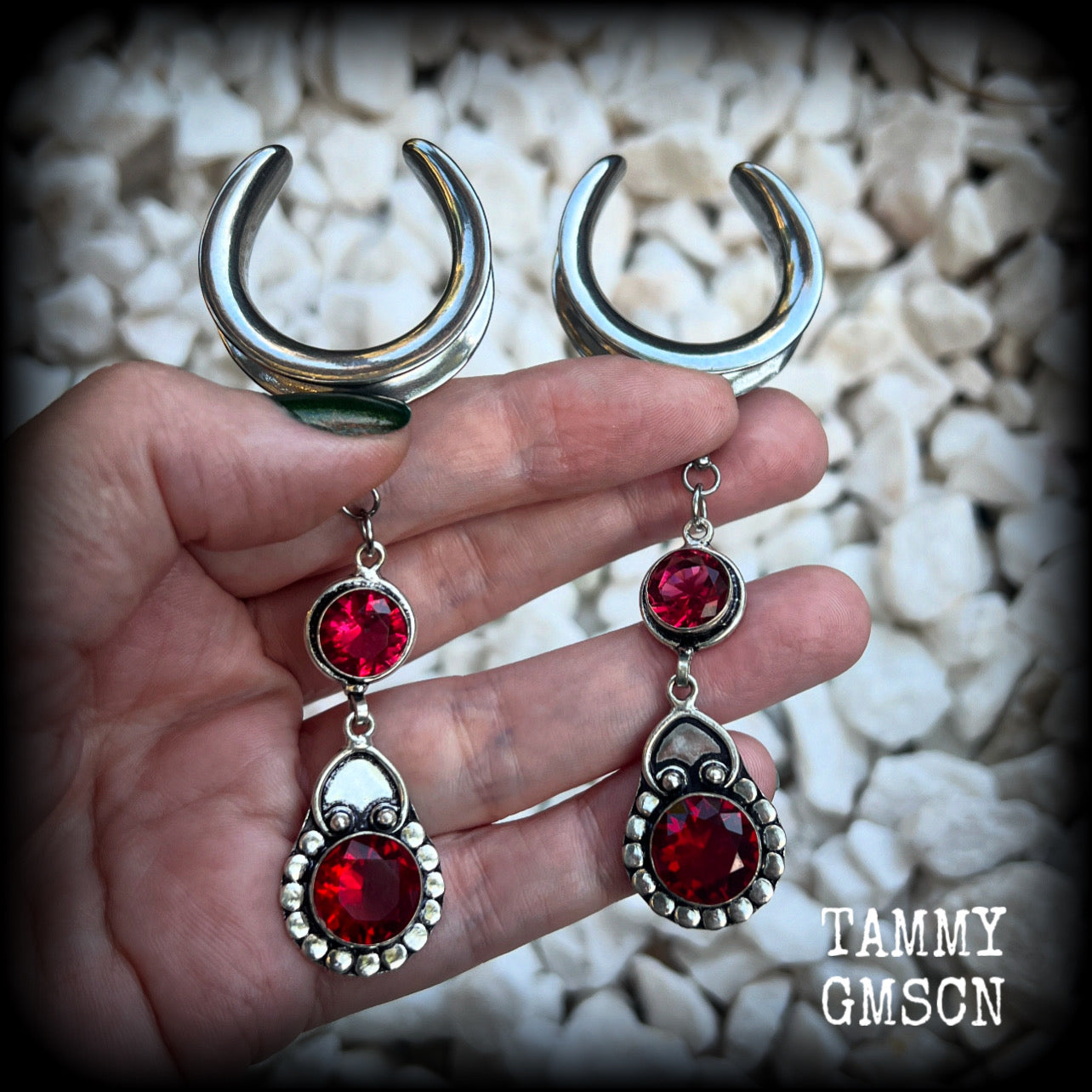 These beautiful boho Garnet ear hangers are made with gorgeous facet gemstones in a beautiful boho antique silver setting, measuring just on 10cm from tip to tip, and weighing 18 grams each, nice and lightweight. 

These earrings have been made on 1.18" gauge (30mm) surgical steel cradles, to be worn in stretched lobes.
