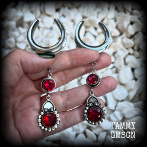 These beautiful boho Garnet ear hangers are made with gorgeous facet gemstones in a beautiful boho antique silver setting, measuring just on 10cm from tip to tip, and weighing 18 grams each, nice and lightweight. 

These earrings have been made on 1.18" gauge (30mm) surgical steel cradles, to be worn in stretched lobes.
