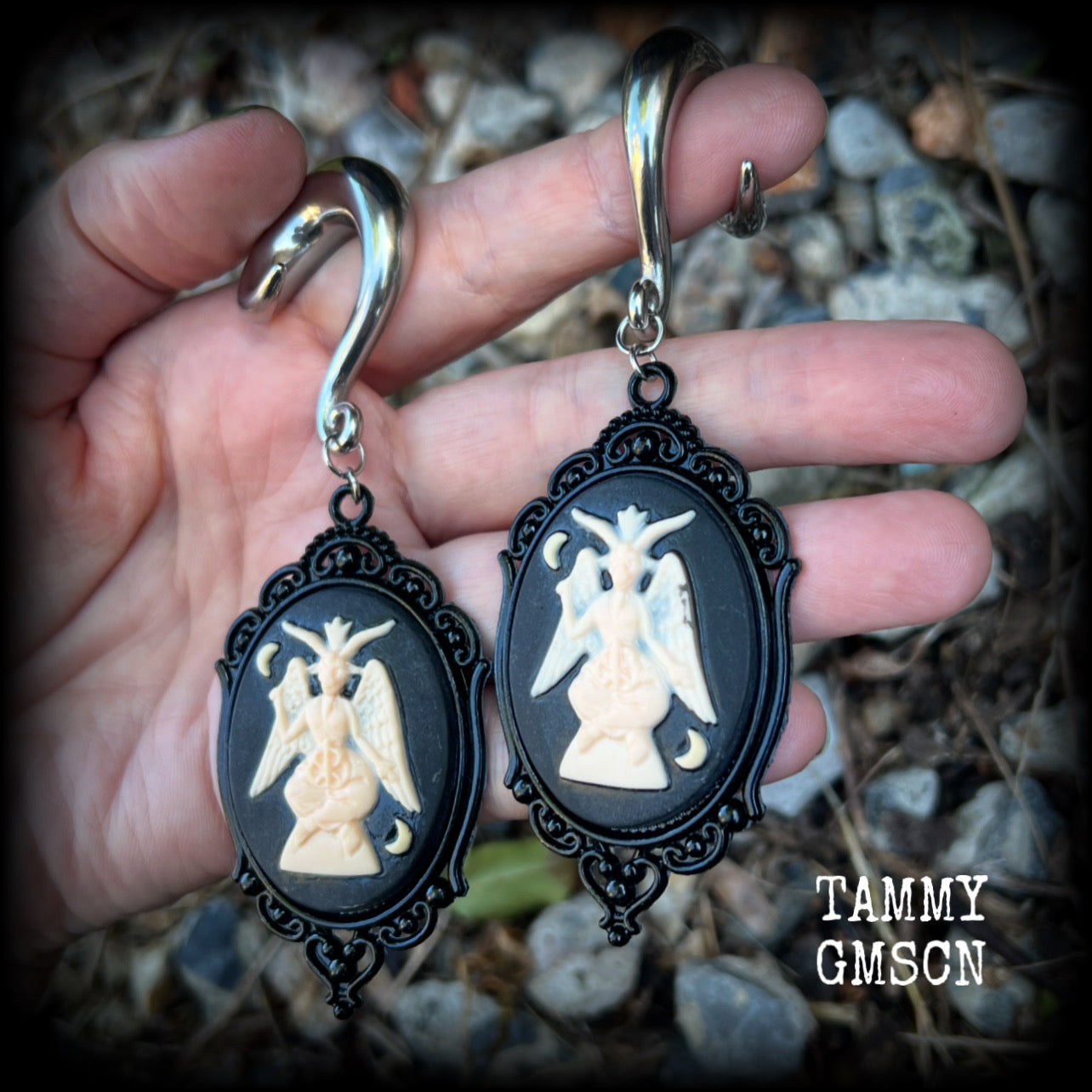 Featuring gorgeous ivory and black enamel Baphomet pendants, these gauged earrings measure just on 10.5cms from tip to tip, and weigh approx 32 grams each.

This pair have been made on 00 gauge (10mm) surgical steel full curls, to be worn in stretched lobes.