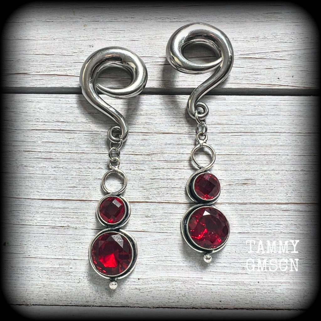 These beautiful dangly gauged earrings feature gorgeous deep red faceted garnet gemstones in an ornate antique silver setting, measuring just on 8cms from tip to tip, and weigh approx 19 grams each.

This pair have been made with 0 gauge (8mm) surgical steel full curl hooks, to be worn in stretched lobes.