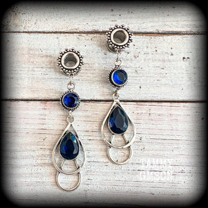 These gorgeous boho tunnel earrings have been made with beautiful blue topaz gemstones in an antique silver setting, are light weight-weighing approx 9 grams each and measure just over 6cms from tip to tip.

These tunnel dangles have been made with 0  gauge (8mm) ornate stainless steel screw fit tunnels.
