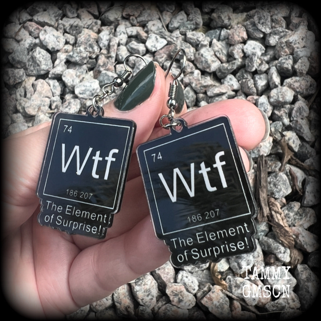 This cheeky pair of earrings features acrylic letter tiles showing the chemical element of Wtf, the Element of Surprise!!!
Measuring just over 6cms from tip to tip, these earrings weigh only a few grams each.

This pair has been made with stainless steel french hooks, suitable for pierced ears.