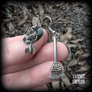 These cute earrings feature antique silver cats and witches brooms! These earrings are nice and light weight at only a few grams each, and nice and dangly, measuring 3- 5cms from tip to tip.
This pair has been made on stainless steel french hooks, suitable for pierced ears.