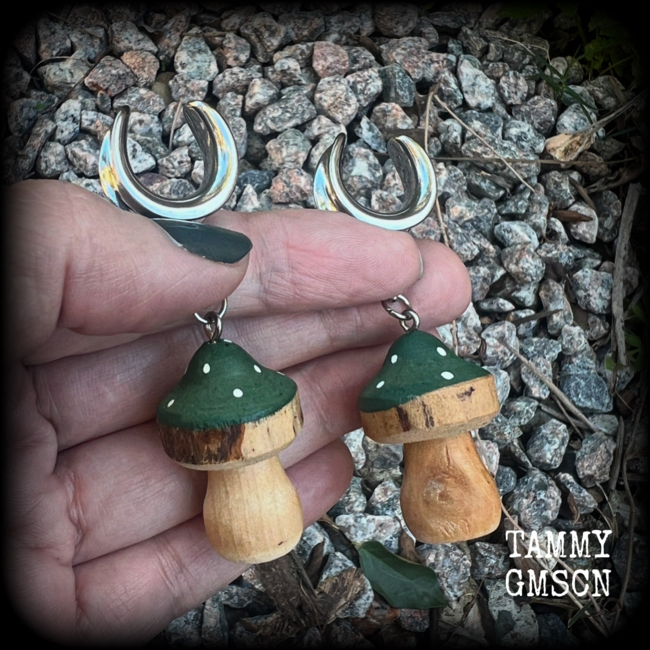 This pair of earrings features gorgeous forest green wood mushrooms, nice and light weight at 8 grams a piece, and nice and dangly at just on 7cms.

This pair has been made on 5/8” gauge (16mm) surgical steel cradles, suitable for stretched lobes.

