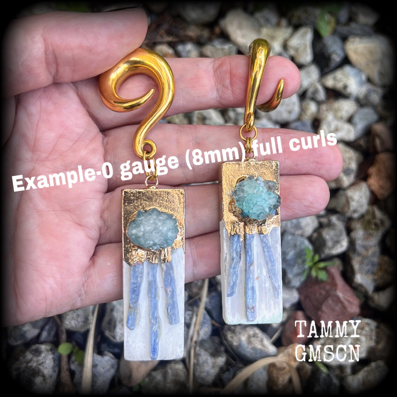 These unique gauged earrings feature selenite with ocean green druzy and sky blue kyanite, measuring approx 10cms from tip to tip, and weighing approx 25 grams each.

This pair have been made on 0 gauge (8mm) surgical steel full curl hooks, to be worn in stretched lobes.
