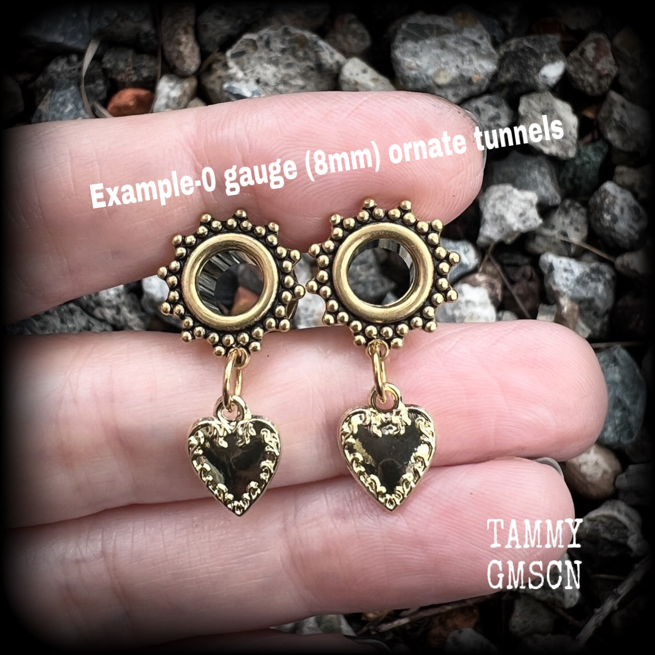 These stunning tunnel earrings feature gorgeous antique gold heart charms, and are nice and lightweight, weighing only a few grams each, measuring just under 4cms from tip to tip.

This pair has been made on 0 gauge (8mm) ornate surgy steel screw fit tunnels-for stretched lobes.
