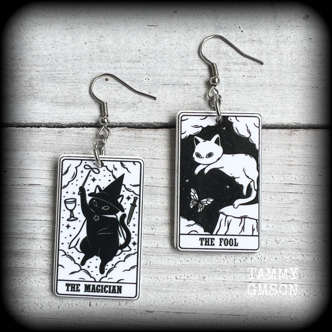 These adorable cat tarot earrings feature The Fool and The Magician lightweight tarot card charms, weighing only a few grams each, and measure approx 5cms from tip to tip.

This pair has been made with stainless steel french hooks, for pierced ears.