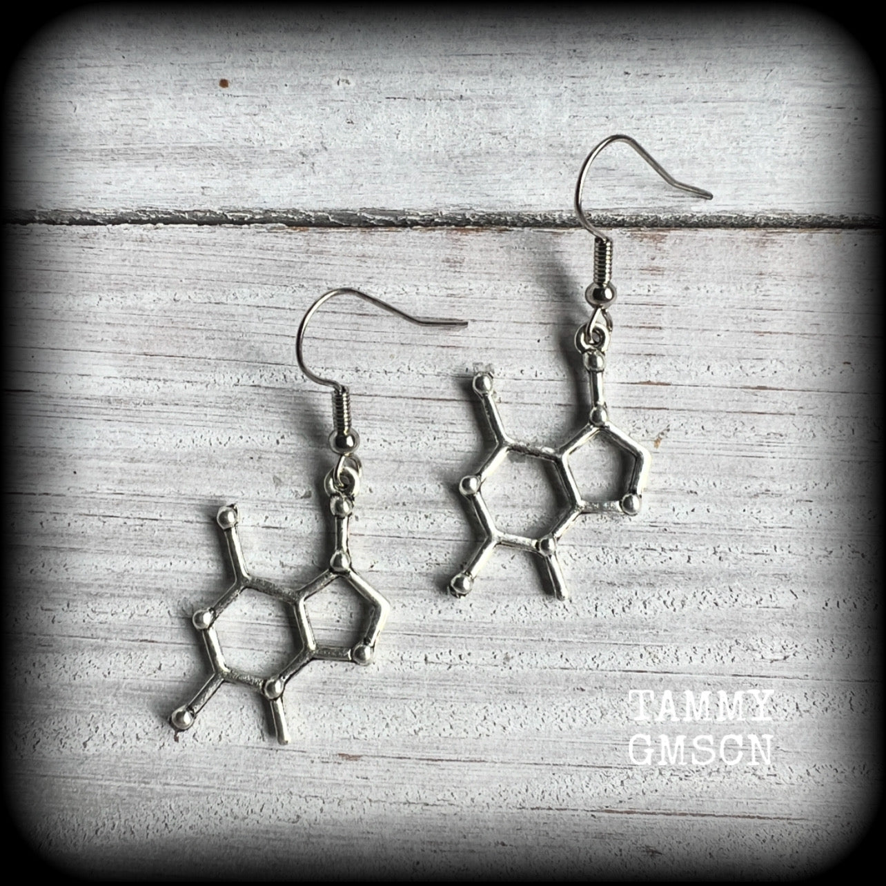 This pair of earrings features antique silver chocolate (theobromine) molecules, measuring approx 5cms from tip to tip, and weighing only a few grams each. 

This pair has been made with stainless steel french hooks, to be worn in pierced ears.