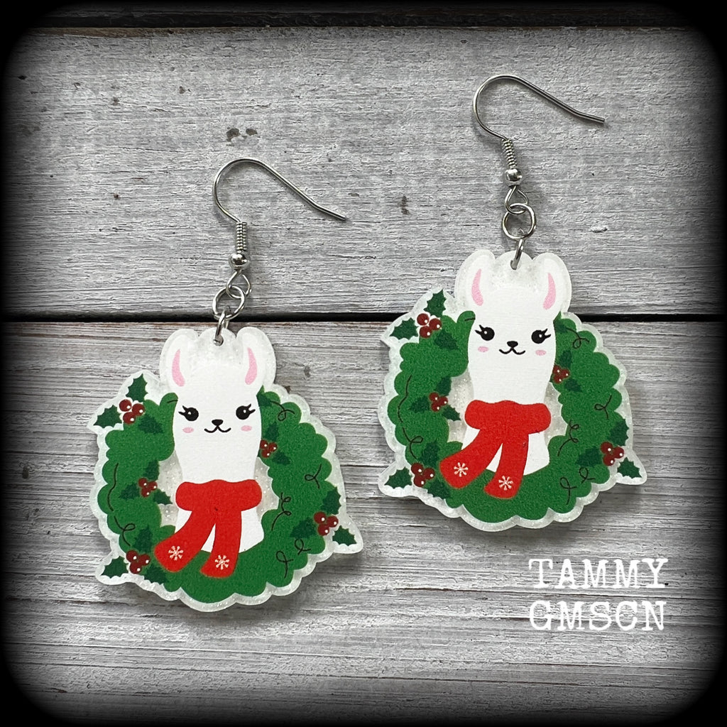 These adorable Christmas earrings feature a smiling Llama poking his cute little face out of a festive Christmas wreath.

These earrings are acrylic and super lightweight, weighing only a few grams each and are nice and dangly, measuring just over 6 cms from tip to tip.

This pair of earrings has been made on stainless steel french hooks, suitable for pierced ears.