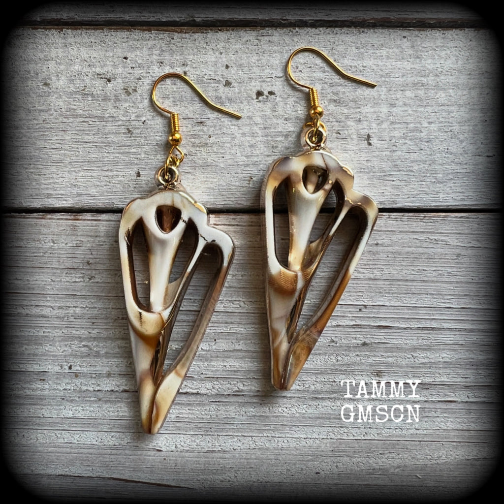 These earrings feature gorgeous acrylic conch sea shell slices , super lightweight- weighing only a few grams each, and nice and dangly, measuring just on 7cms from tip to tip. 

These beautiful earrings have been made with antique gold french hooks-for pierced ears.