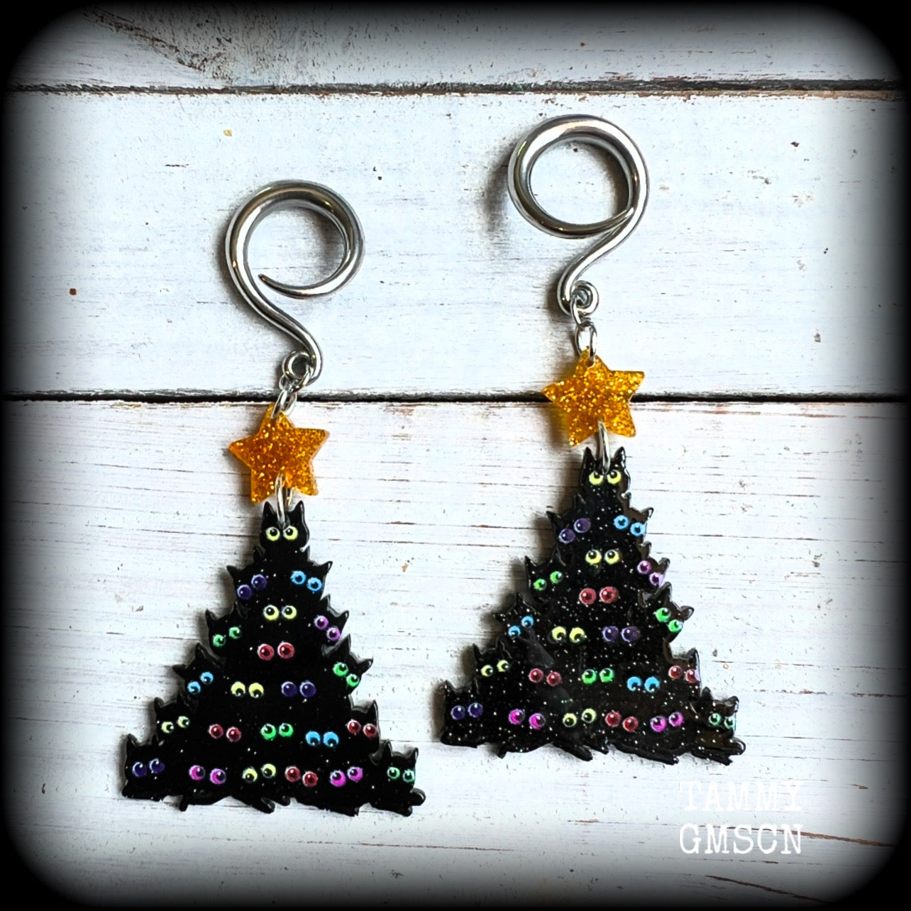 Featuring a spooky cute Christmas tree with STACKED BLACK CATS topped with a glittering gold star, these adorable earrings weigh in at approx 5 grams a piece, and measure approx 8 cms from tip to tip.

This pair has been made on 6 gauge (4mm) surgical steel full curl hooks, to be worn in stretched lobes.