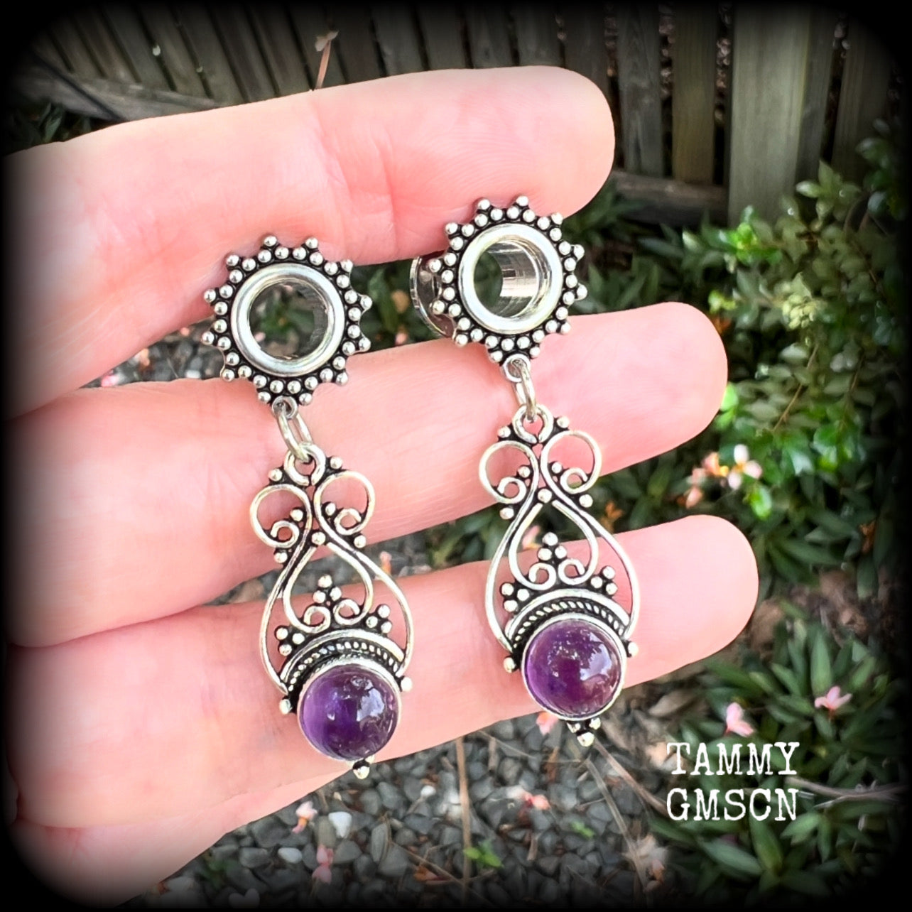 These beautiful boho tunnel earrings feature gorgeous polished amethyst gemstones, weighing approx 5 grams each and measure just under 5cms from tip to tip.

This pair has been made with 0 gauge (8mm) ornate surgical steel screw fit tunnels.
