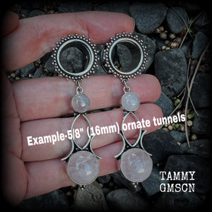 These beautiful earrings have been made with gorgeous translucent pink rose quartz gemstones in a beautiful big boho antique silver setting, weighing approx 13 grams each and measure just over 7cms from tip to tip.
This pair has been made with 5/8” gauge (16mm) gauge ornate surgical steel screw fit tunnels.
