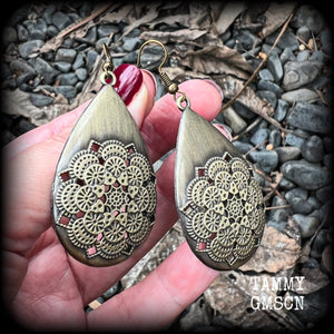 These beautiful teardrop earrings feature an intricate antique bronze mandala, are nice and light weight, weighing 6 grams each, and measuring just on 7 cms from tip to tip.
This pair have been made with antique french hooks, suitable for pierced ears.