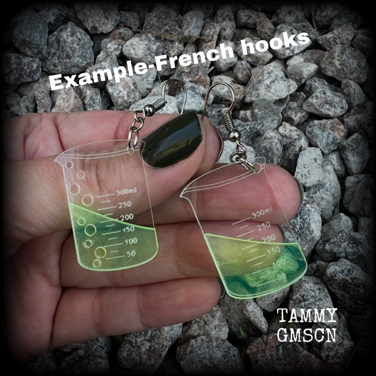 This pair of earrings features a pair of absolutely adorable classic Griffin chemistry beakers full of bubbly green liquid, measuring just under 6cms from tip to tip and weighing only a few grams each.

This pair have been made on stainless steel french hooks, suitable for pierced ears.