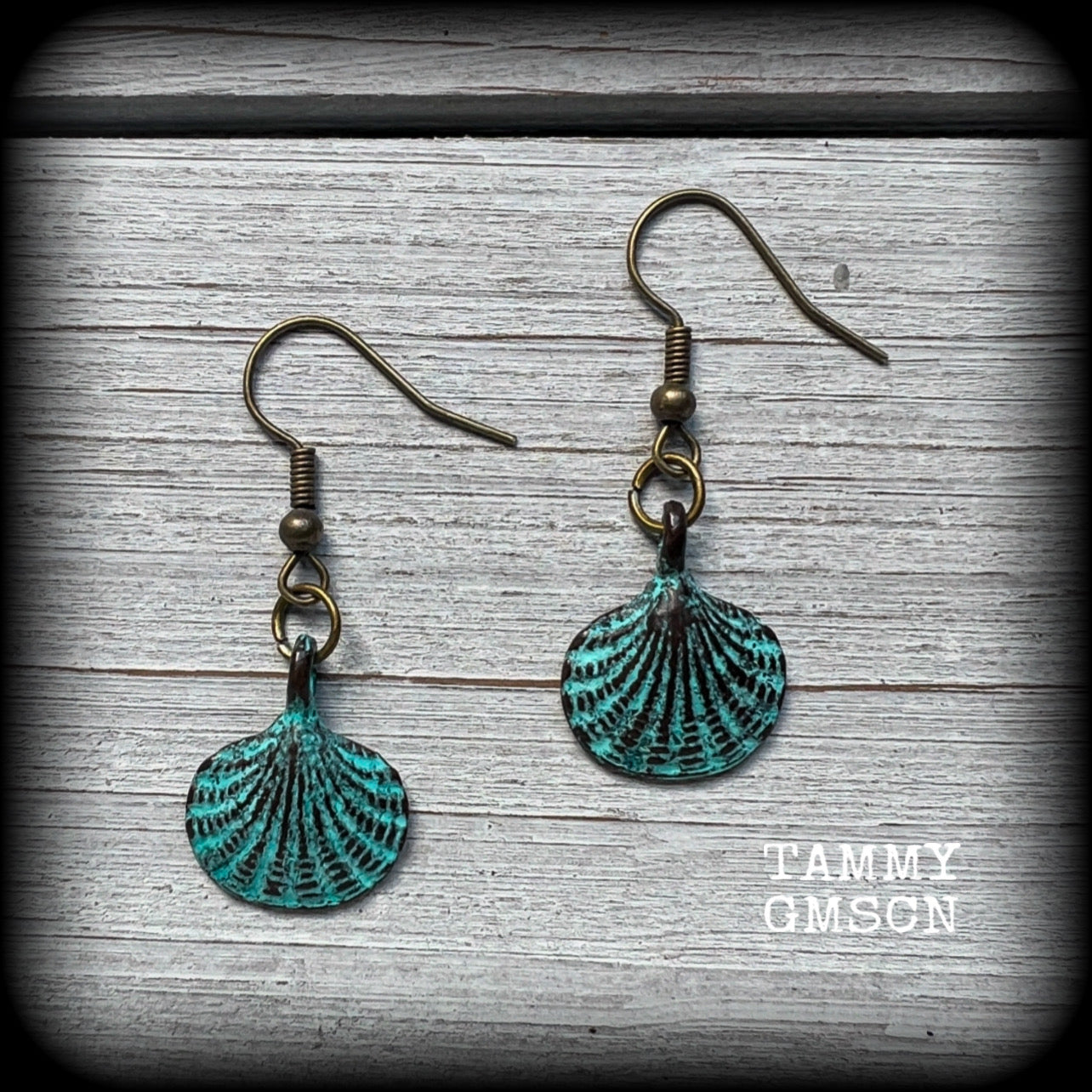 This is a simpler pair of earrings from our Sea Hag range, featuring a single gorgeous verdigris patina charm shell, measuring just under 4cms from tip to tip and weighing only a few grams each.

This pair has been made with antique bronze french hooks, for pierced ears.