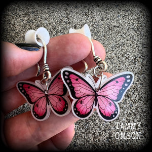 This is a pair of beautiful pink butterfly earrings, available on a selection of hooks and clasps for pierced ears and stretched lobes.