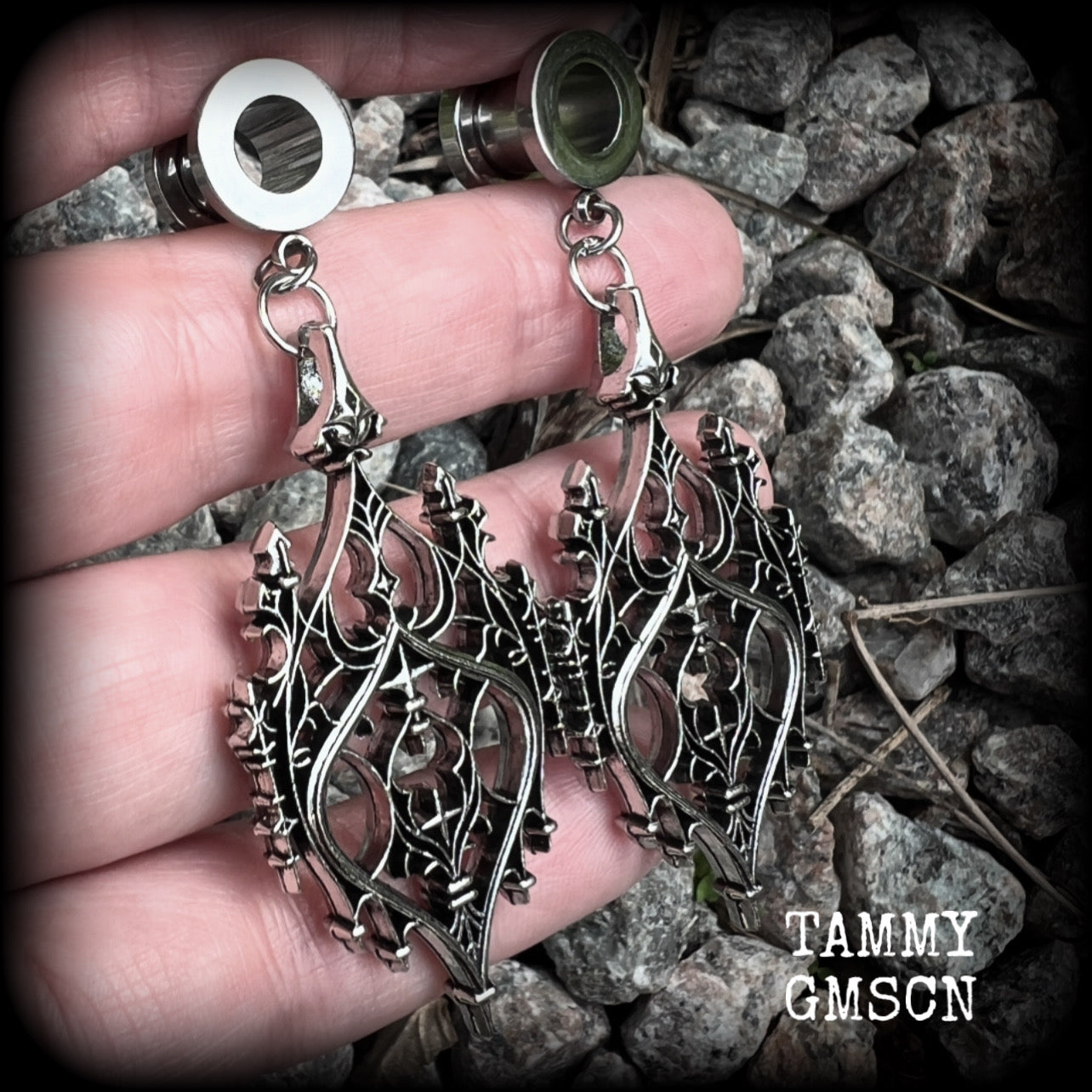 These gorgeous gothic tunnel earrings feature a beautiful antique silver ornate gothic cathedral architectural arch, measuring just on 7cms from tip to tip, and weighing approx 10 grams each.

This pair has been made on 0 gauge (8mm) surgical steel screw fit tunnels.