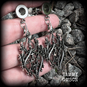 These gorgeous gothic tunnel earrings feature a beautiful antique silver ornate gothic cathedral architectural arch, measuring just on 7cms from tip to tip, and weighing approx 10 grams each.

This pair has been made on 0 gauge (8mm) surgical steel screw fit tunnels.