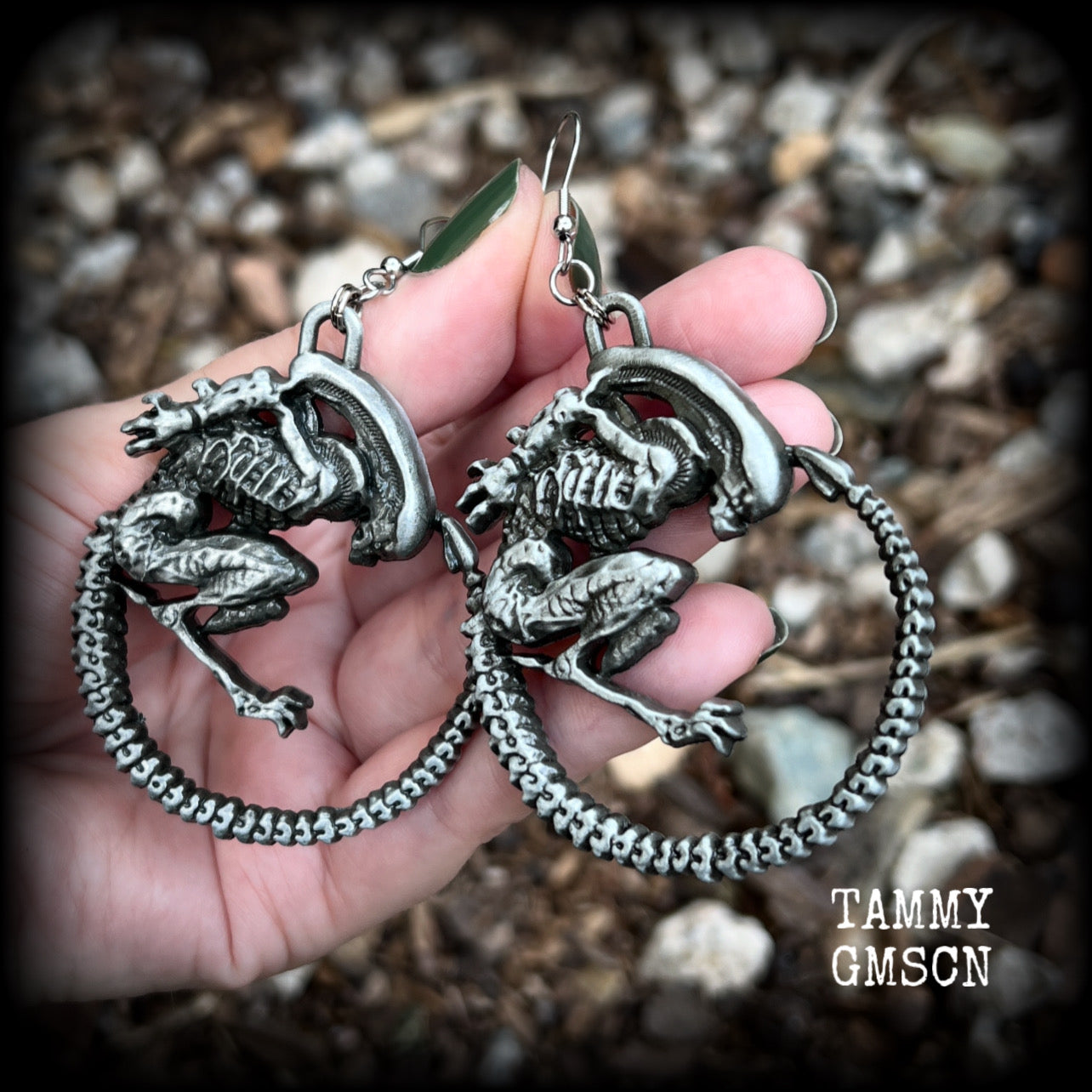 This pair of awesome earrings features large Alien Queen Xenomorphs, measuring 8.5cms from tip to tip (nice and big), and weigh 35 grams each (these are HEAVY).

This pair have been made with stainless steel french hooks-suitable for pierced ears.