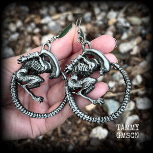 This pair of awesome earrings features large Alien Queen Xenomorphs, measuring 8.5cms from tip to tip (nice and big), and weigh 35 grams each (these are HEAVY).

This pair have been made with stainless steel french hooks-suitable for pierced ears.