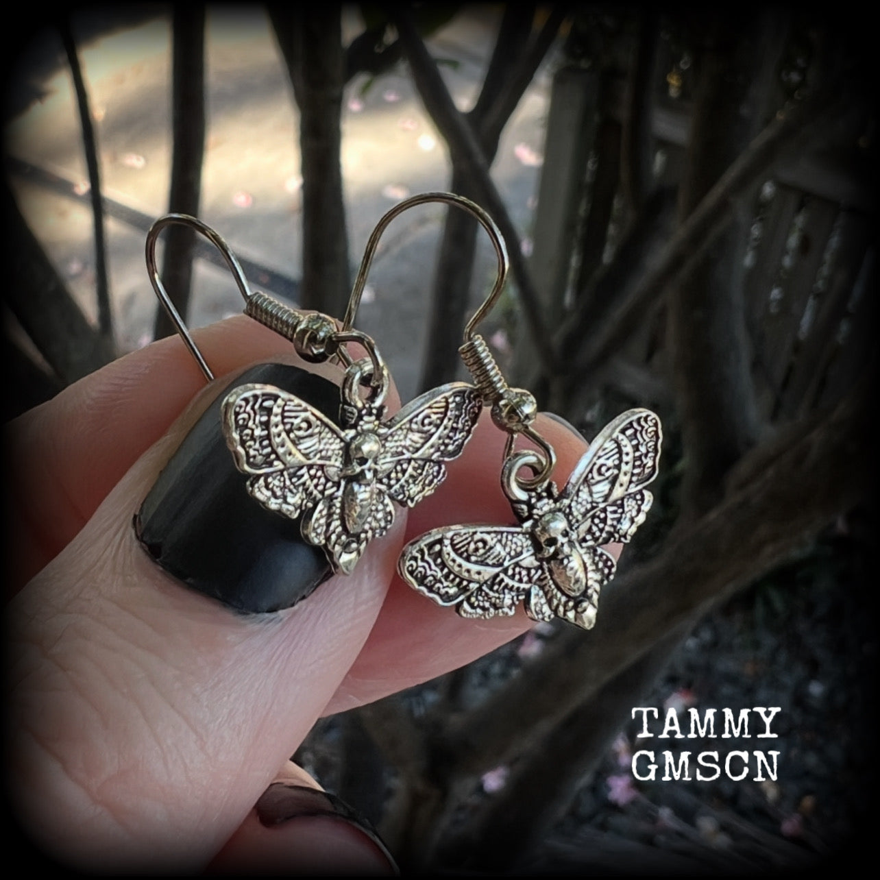 These petite antique silver Deathshead moth earrings feature a gorgeous gothic deathshead moth charm measuring just on 3cms, and weigh only a gram or two each.

This pair has been made on stainless steel french hooks, for pierced ears.