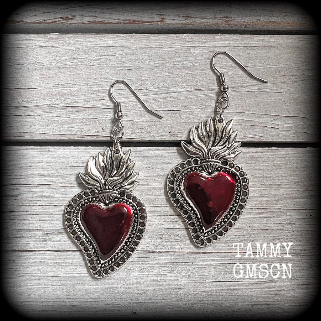 These beautiful red enamel and antique silver sacred heartearrings are nice and lightweight at approx 5 grams a piece, measuring just over 7cms from tip to tip.


This pair has been made on stainless steel french hooks to be worn through pierced ears.