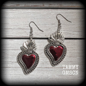 These beautiful red enamel and antique silver sacred heartearrings are nice and lightweight at approx 5 grams a piece, measuring just over 7cms from tip to tip.


This pair has been made on stainless steel french hooks to be worn through pierced ears.