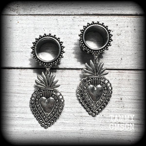 These gorgeous tunnel earrings feature beautiful antique silver sacred hearts, are nice and lightweight, weighing approx 10 grams each and measure just under 7cms from tip to tip.

This pair has been made with 9/16" (14mm) gauge ornate surgical steel screw fit tunnels.