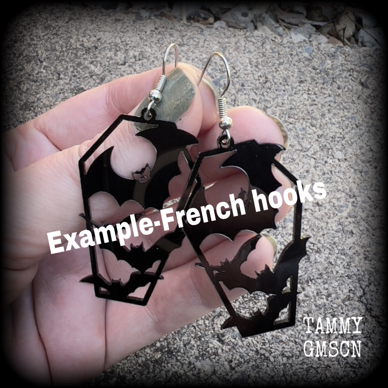 These awesome earrings feature pitch black acrylic coffins filled with bats! These earrings measure just over 6 cms from tip to tip and are nice and lightweight at only a few grams each.

This pair have been made on stainless steel french hooks, to be worn in pierced ears.