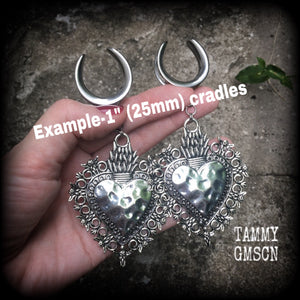 These gorgeous antique silver gauged earrings feature big beautiful sacred hearts, measuring 11cms from tip to tip, and weighing approx 21 grams each.

This pair has been made on 1" gauge (25mm) surgical steel cradles, to be worn in stretched lobes.