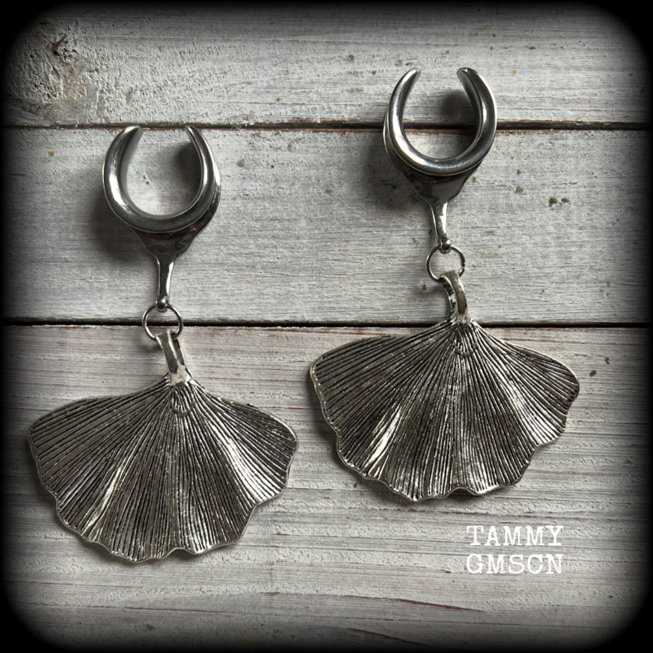 Inspired by Gaia, these beautiful big gauged earrings feature antique silver ginkgo leaves, weighing approx 16 grams a piece, and are nice and dangly, measuring just over 8cms from tip to tip.

This pair has been made on 3/4” gauge (19mm) surgical steel cradles, to be worn in stretched lobes.