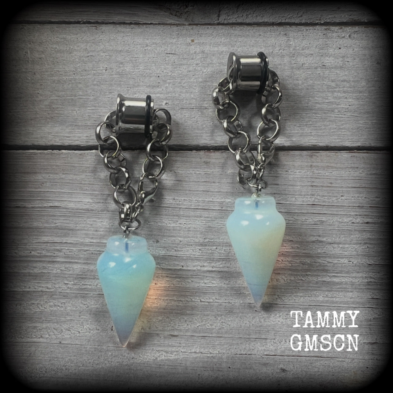 These gorgeous opalite earrings have been made with transluscent gemstone pendulums, are nice and dangly measuring in at just on 7.5cms from tip to tip and not too heavy at 11 grams a piece.

🔥🔥🔥 This listing is for a chunky chain/lobster clasp combination suitable for 00 gauge and larger. If you choose a smaller size of tunnel than 00 gauge we will make these on a smaller chain.

💥This listing includes one pair of surgical steel single flared O-ring earlets