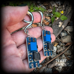 These awesome earrings feature pieces of blue circuitry, are nice and dangly, measuring just on 7cms from tip to tip, and nice and light weight, weighing approx 12 grams each.

This pair has been made on 2 gauge (6mm) surgical steel full curl hooks, to be worn in stretched lobes.