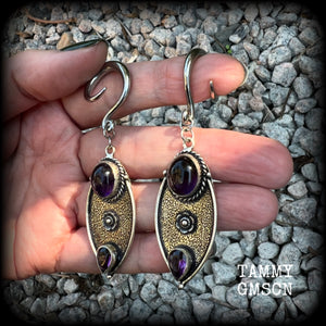 Featuring beautiful purple amethyst gemstones in a boho antique silver setting , this pair of earrings weighs approx 8 grams a piece and measure just under 8cms from tip to tip.

This pair have been made on 6 gauge (4mm) surgical steel full curl hooks, to be worn in stretched lobes.