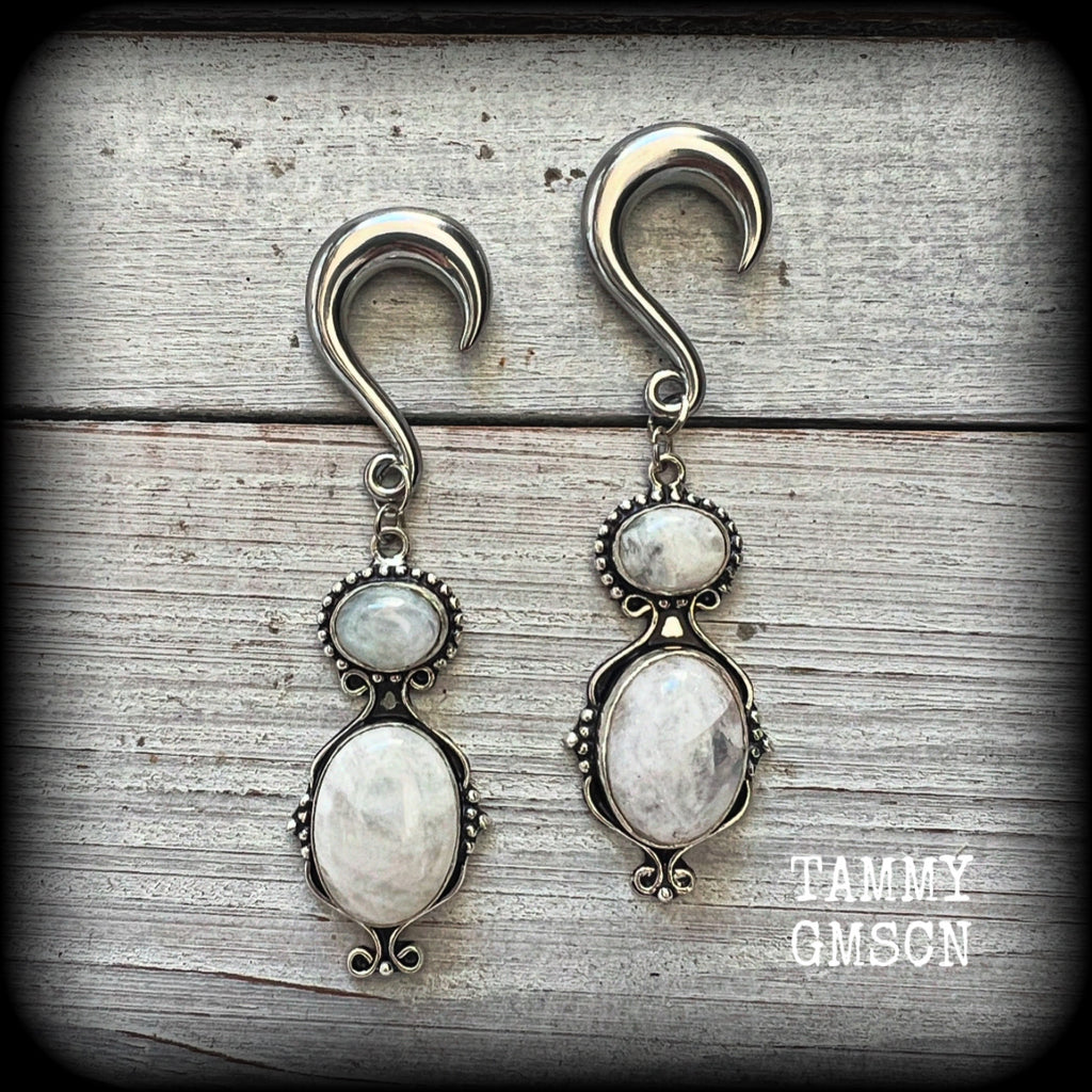 These gauged earrings have been made with gorgeous big polished Rainbow moonstone gemstones in a beautiful boho antique silver setting, measuring approx 8cms from tip to tip, and weighing approx 12 grams each, not too heavy.

These earrings have been made on 2 gauge (6mm) surgical steel half curl hooks, to be worn in stretched lobes.

