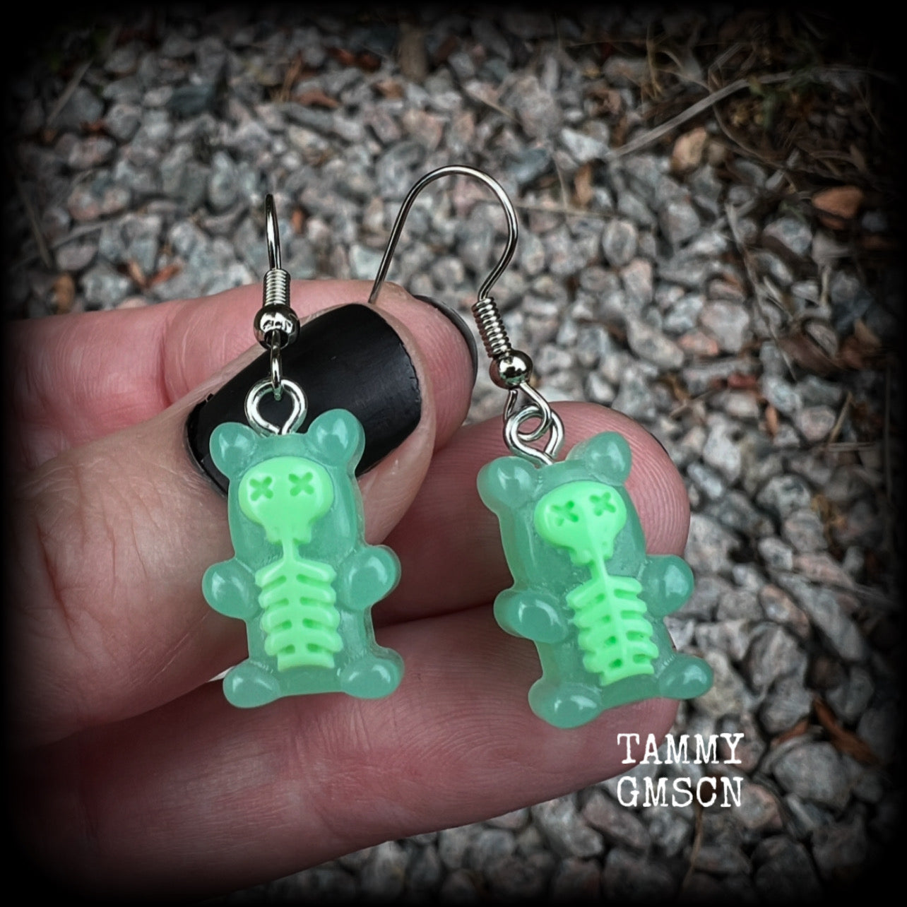 Featuring spooky cute green skeleton gummy bears, these adorable earrings measure just on 5cms from tip to tip and are super light weight, weighing only a gram or two each.

This pair has been made with stainless steel french hooks, to be worn in pierced ears.