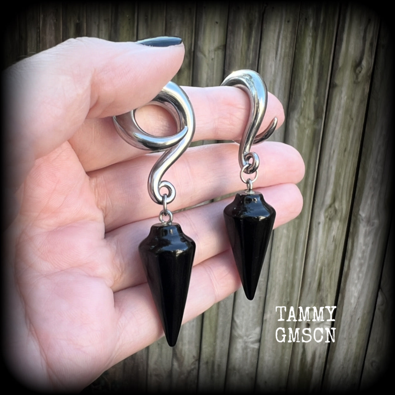 These earrings have been made with gorgeous pitch black obsidian pendulums, measuring 7.5cms from tip to tip, and weighing approx 22 grams each.

This pair have been made with 00 gauge (10mm) surgical steel full curl hooks, to be worn in stretched lobes.