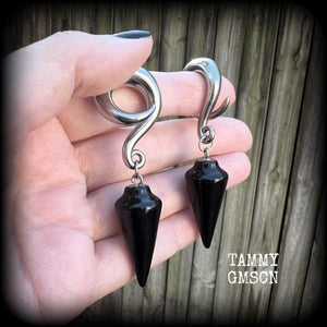 These earrings have been made with gorgeous pitch black obsidian pendulums, measuring 7.5cms from tip to tip, and weighing approx 22 grams each.

This pair have been made with 00 gauge (10mm) surgical steel full curl hooks, to be worn in stretched lobes.