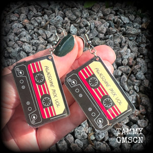 This awesome pair of earrings features a pair of classic 80’s mix tapes, are nice and lightweight weighing only a few grams each, and measure approx 7cms from tip to tip.

This pair has been made on stainless steel french hooks, suitable for pierced ears.