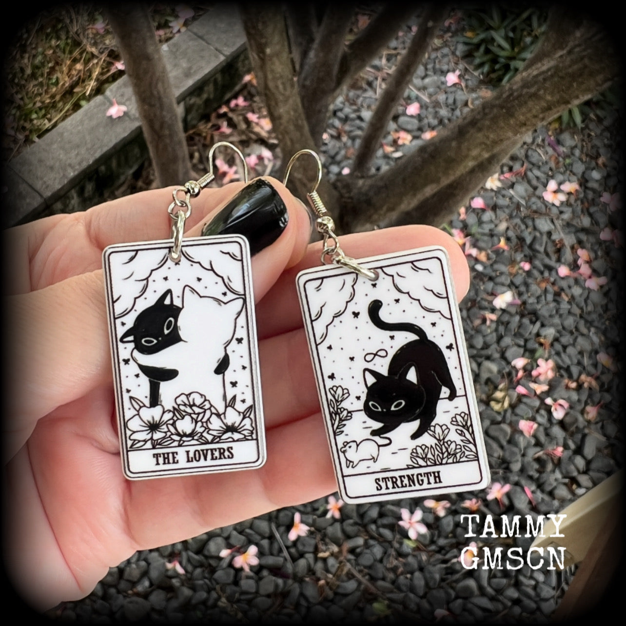 These adorable cat tarot earrings feature The Lovers and Strength lightweight tarot card charms, weighing only a few grams each, and measure approx 5cms from tip to tip.

This pair has been made with stainless steel french hooks, for pierced ears.
