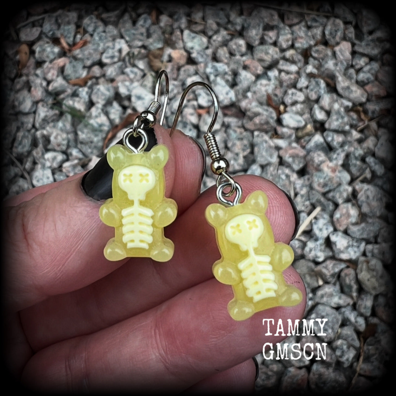 Featuring spooky cute yellow skeleton gummy bears, these adorable earrings measure just on 5cms from tip to tip and are super light weight, weighing only a gram or two each.

This pair has been made with stainless steel french hooks, to be worn in pierced ears.