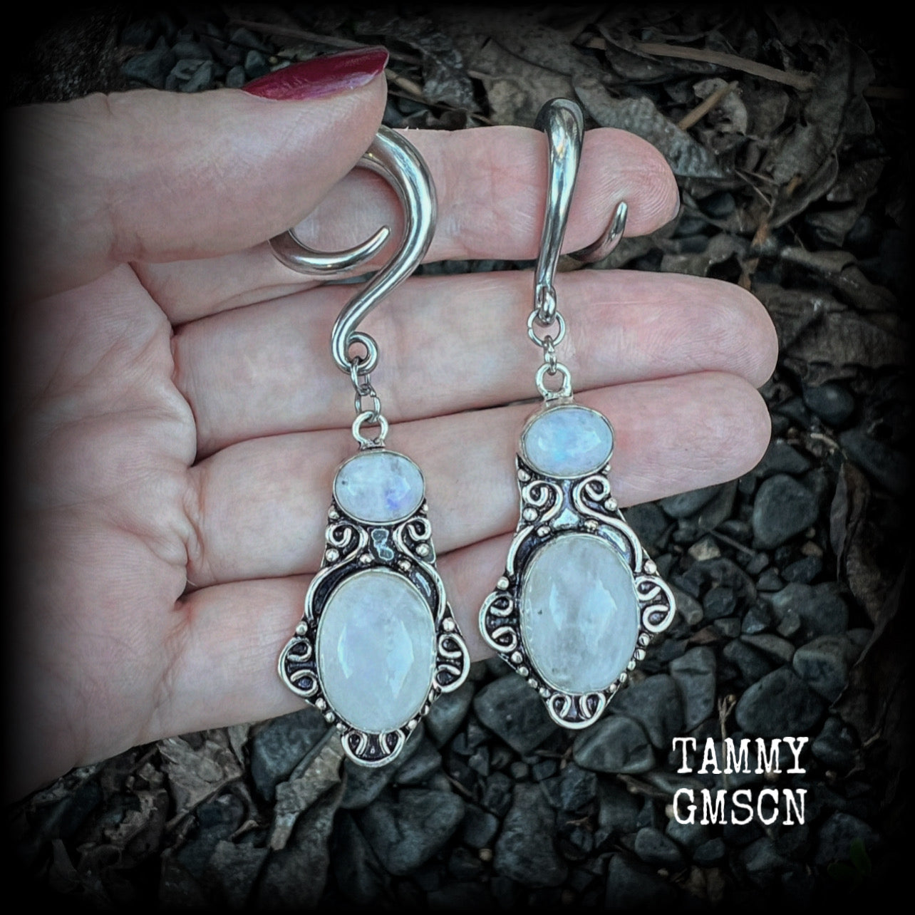 These gemstone earrings feature beautiful big rainbow moonstones in a beautiful antique silver setting.  These earrings are lovely and dangly measuring 8cms from tip to tip, and weighing 14 grams each. Made on 2 gauge (6mm) surgical steel full curls.