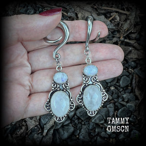 These gemstone earrings feature beautiful big rainbow moonstones in a beautiful antique silver setting.  These earrings are lovely and dangly measuring 8cms from tip to tip, and weighing 14 grams each. Made on 2 gauge (6mm) surgical steel full curls.
