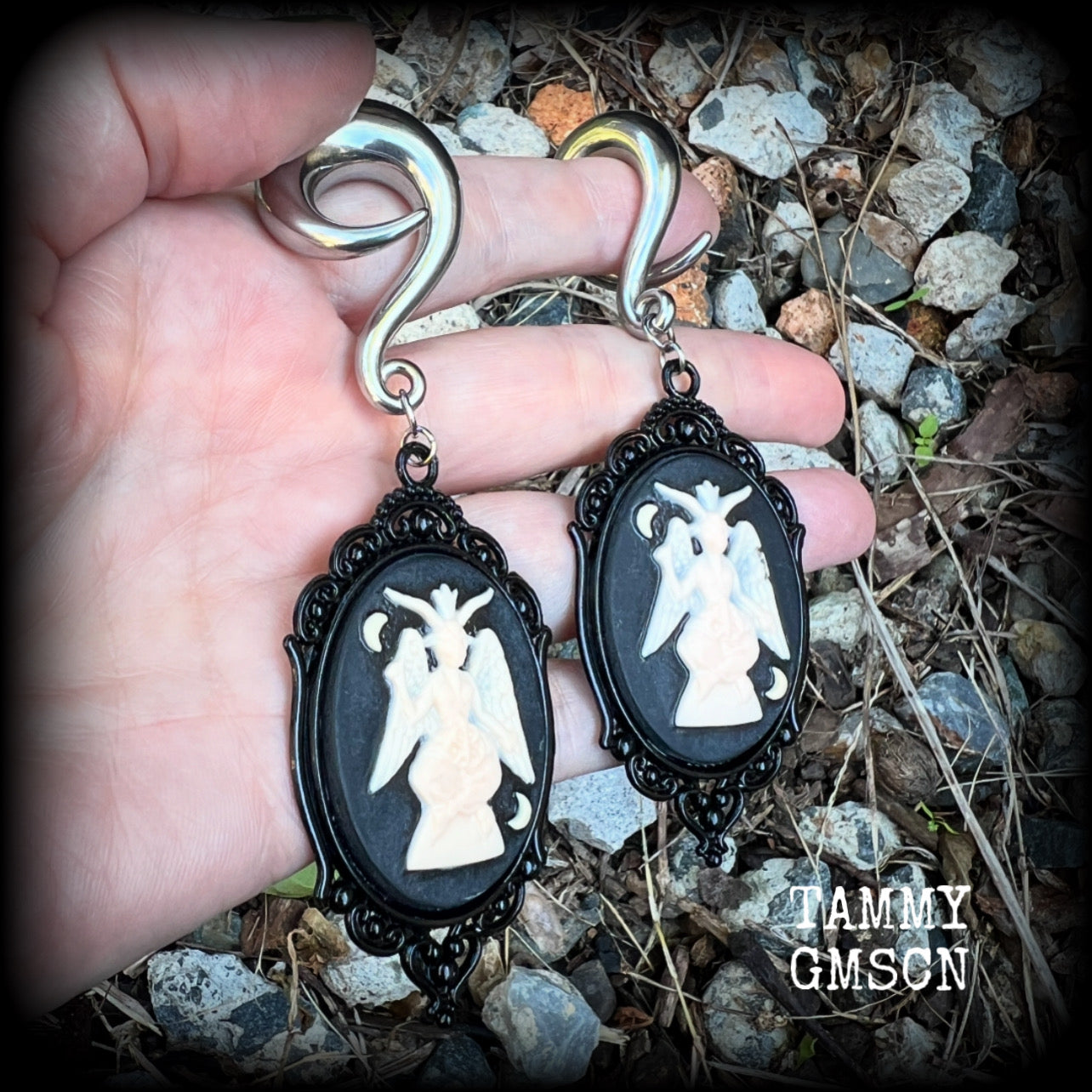 Featuring gorgeous ivory and black enamel Baphomet pendants, these gauged earrings measure just on 10.5cms from tip to tip, and weigh approx 32 grams each.

This pair have been made on 00 gauge (10mm) surgical steel full curls, to be worn in stretched lobes.