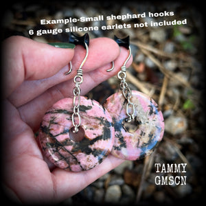 This is a pair of gorgeous ear hangers featuring dusty pink and chocolate brown Rhodonite gemstone donuts cradled in antique silver chain, weighing approx 23grams a piece, and measuring just under 7 cms from tip to tip.

This pair has made with small antique silver shephards hooks, to be worn with silicone earlets in stretched lobes from 8gauge (3mm).