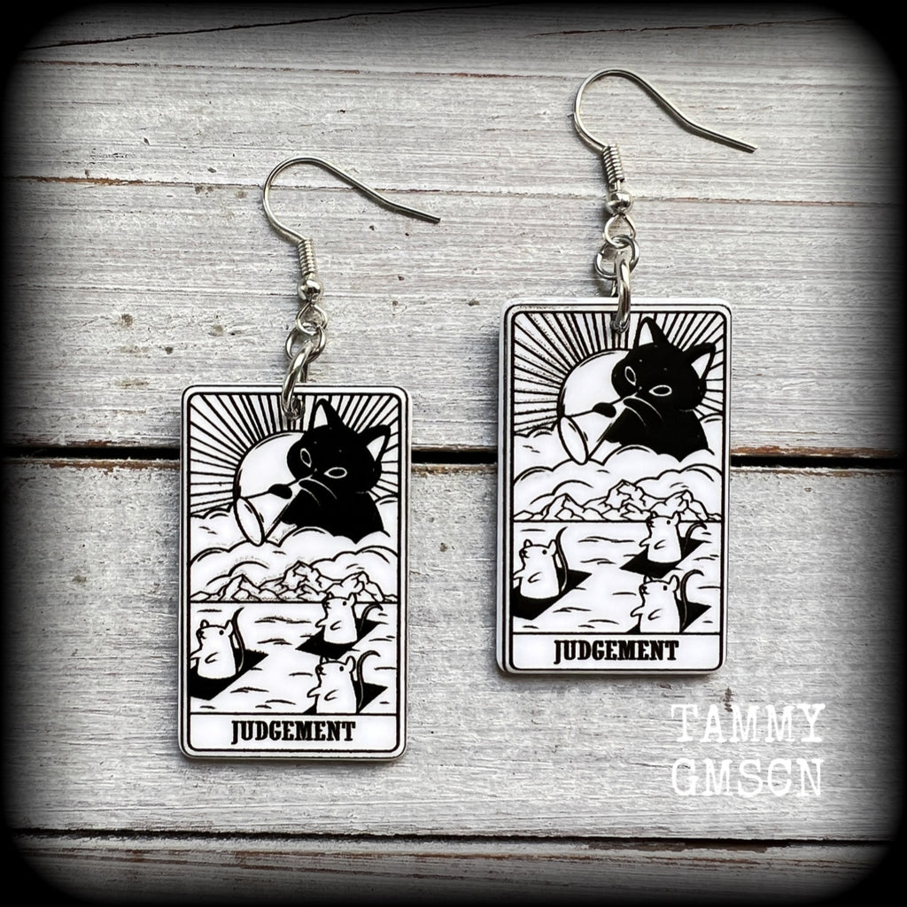 These adorable 'Judgement' tarot card earrings feature a lightweight tarot card charm, weighing only a few grams each, and measure approx 5cms from tip to tip.
This pair has been made with stainless steel french hooks, for pierced ears.