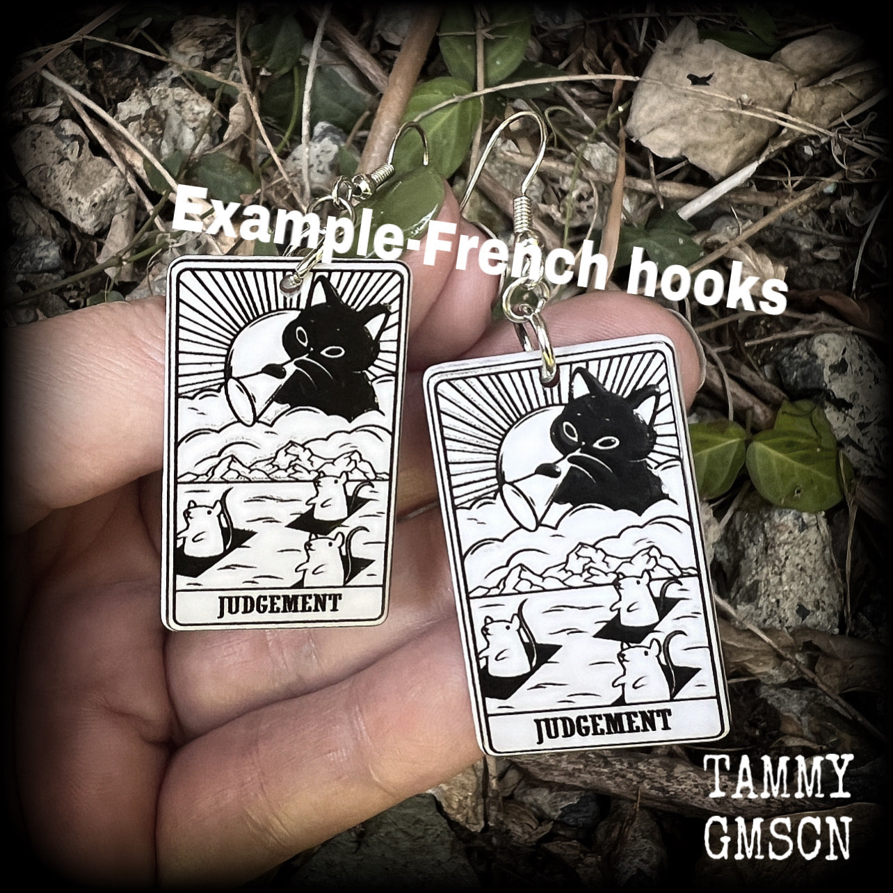 These adorable 'Judgement' tarot card earrings feature a lightweight tarot card charm, weighing only a few grams each, and measure approx 5cms from tip to tip.
This pair has been made with stainless steel french hooks, for pierced ears.